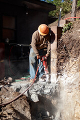 Jackhammering a thick concrete slab