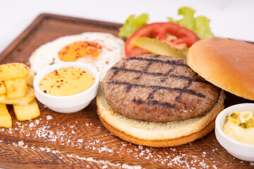 Tasty grilled burger with ingredients. Delicious burger