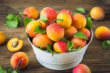 Fresh and ripe organic apricots on the wooden table
