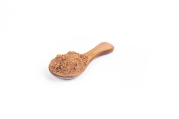 Studio lighting. allspice on a wooden spoon, on a white background. There is a shadow. Close-up. No isolation.