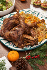 New Year dinner table with roasted turkey, chicken and other dishes.