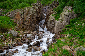 Flow of the waterfall between two rocks