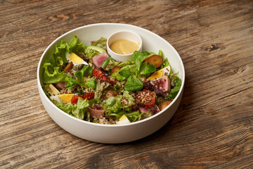 Quinoa salad with boiled egg and fresh vegetables