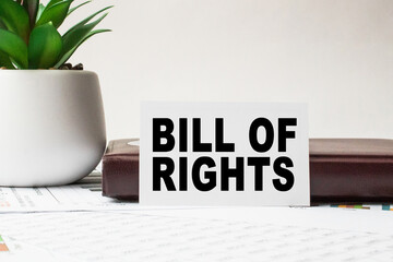 Notepad with inscriptions BILL OF RIGHTS on a white background. business concept.