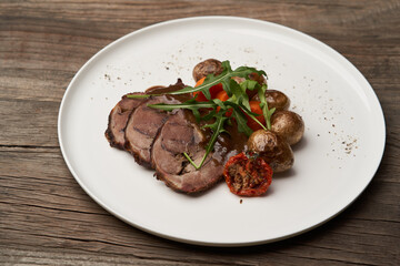 Baked pork and potatoes. Pork meat and vegetables