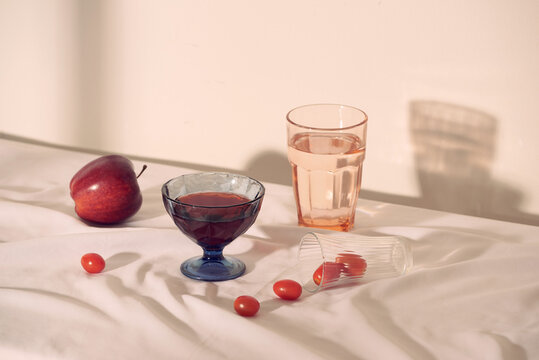 Transparent glass and fresh juicy ripe apple