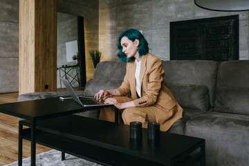 Adult confident business coach conducting online training with laptop at workspace