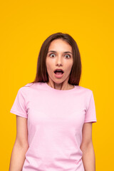 Fototapeta premium Shocked woman with mouth opened looking at camera