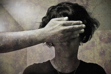 Abstract image of mouthless young woman and male's hand covering her eyes. Concept of abusing, domestic violence or kidnapping. Dark mood, fear, no voice and sight. Removal of free speech.