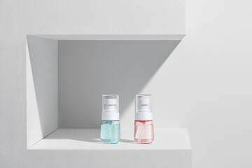 Luxury niche cosmetic bottles on shelf. Product display concept