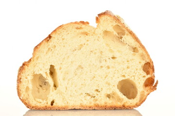 Fragrant French hearth bread, close-up, isolated on white.