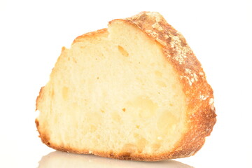 Fragrant French hearth bread sliced into slices, close-up, isolated on white.