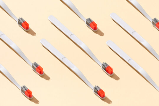 Toothbrushes on yellow background
