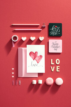 Valentine's Day or Love composition. Artistic concept with painted cards. Flat lay, top view.