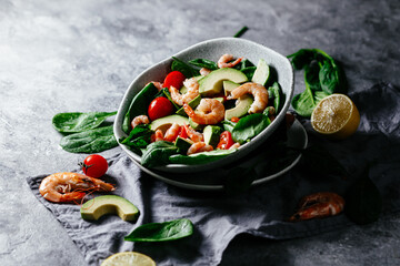 Levitating salad with prawns, avocado and spinach.