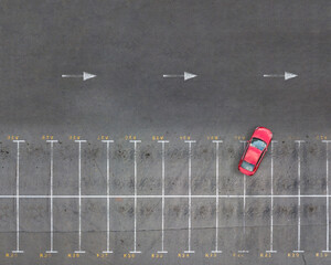 Panoramic view from drone above empty parking spaces.