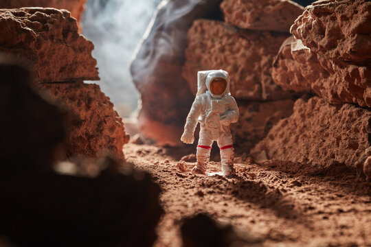Cosmonaut on a cacao rocky planet.