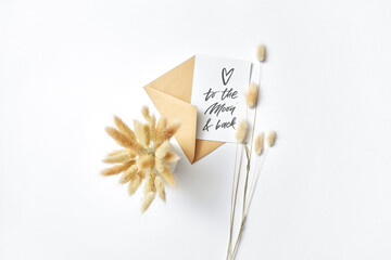 Handmade paper card and ears of grass.