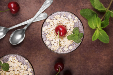 Healthy food concept. Dessert with oatmeal and chia seeds garnished with cherries