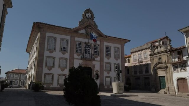 Chaves, Portugal - September 6, 2020:  DOLLY - Chaves City Hall (Camara Municipal) is perched atop the Camoes Square. Statue erected in honor of Afonso, 8th count of Barcelos and 1st Duke of Braganza.
