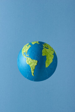 World map of planet earth land shape in recycled papercut craft