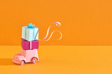 Gift boxes on toy vintage car