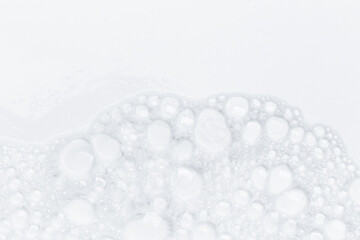 Foam bubble from soap or shampoo for washing isolated on white background from above