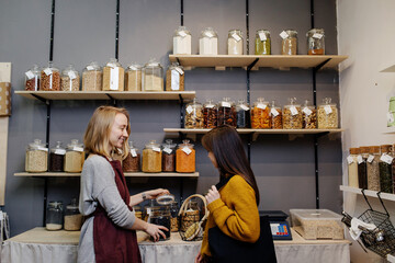 Seller offering buyer product for trial in organic shop