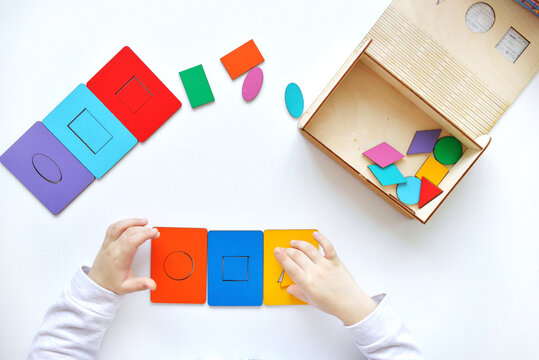 Learning colors and shapes. Children's wooden toy. The child collects a sorter. Educational logic toys for kid's. Kindergarten educational toys, Cognitive skills, Learn Through Play tools concept