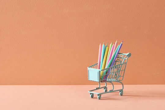 colored pencils in the mini shopping cart