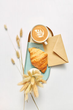 Greeting card with coffee and croissant.