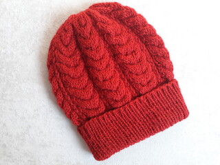 red knitted cap
hat with braids
cozi hat
fashionable
