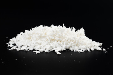 white artificial synthetic snow on black background