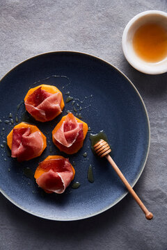 Sliced Persimmon and Prosciutto and Honey