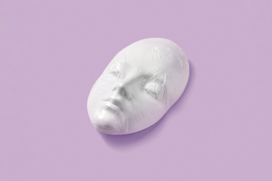 Plaster face mask in a plastic foil.
