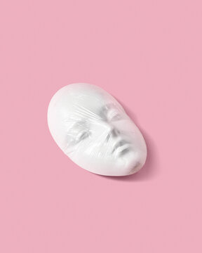 Gypsum face mask in a plastic foil.