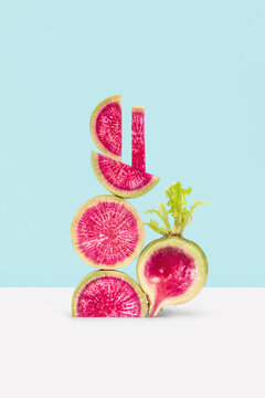 Geometric balancing slices of red radish.