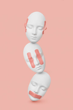 Vertical gypsum masks with plaster on faces.