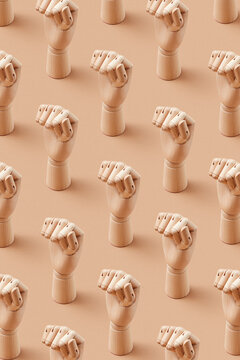 Wooden mannequin hand fists pattern.