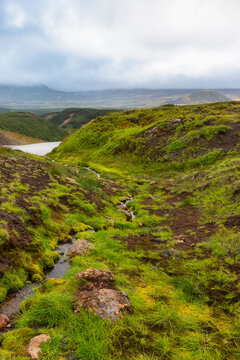 Scenery with green area at the foot of Mutnovsky volcano, Kamchatka, Russia.