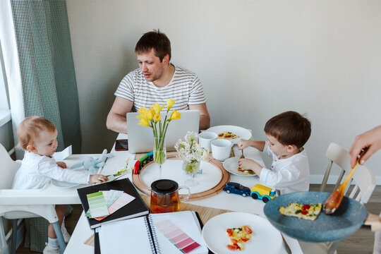 Family having breakfast at home together