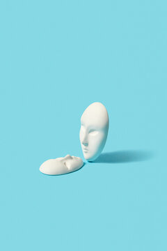 Two plaster face masks.