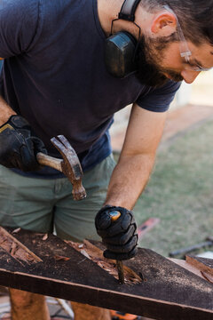 Man chiseling wood