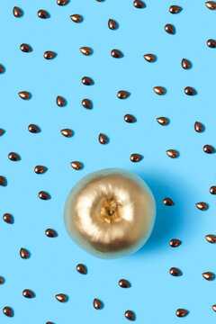 Golden painted apple and seeds pattern.