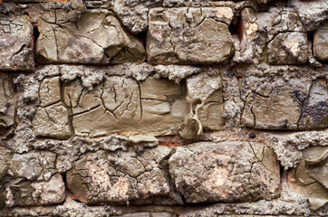 Photo of brick wall covered by cement