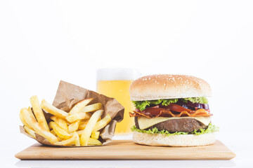 Hamburger with fries and beer, isolated on white background.