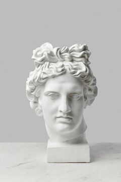 Gypsum statue of goddess head.