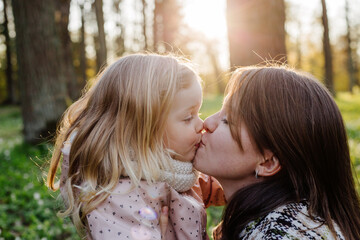 Mother and daughter resting in park