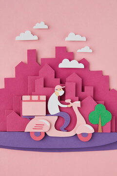 Handmade from paper courier on scooter.