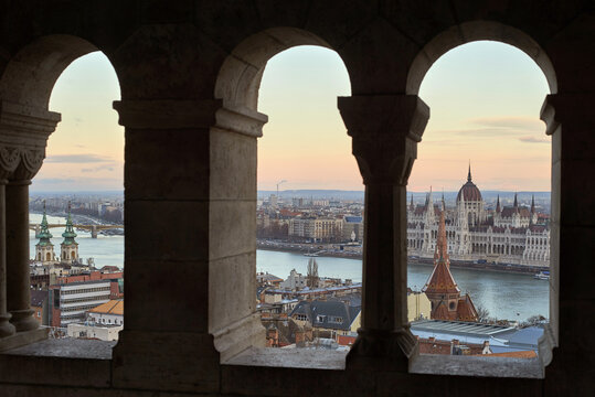View through stone arches to sityscape of Budapest, Hungary.